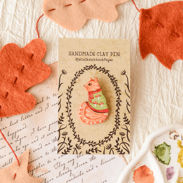 Familiar Collection &quot;A Ginger Cat in Mushroom Cape&quot; clay pin